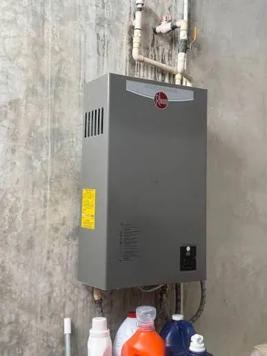 Tankless water heater repair on a wall-mounted unit in Lancaster, PA