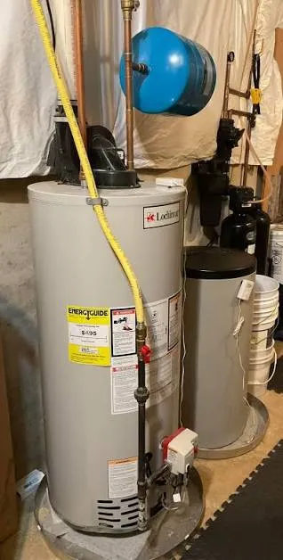 Technician diagnosing a tankless water heater gas supply issue in Lancaster, PA