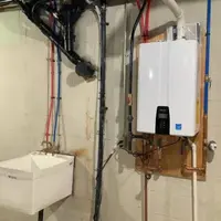 Tankless water heater installation on a Lancaster, PA basement wall
